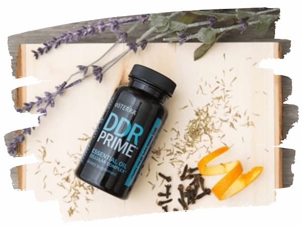 ddr prime essential oil supplement surrounded by thyme leaves, cove buds and orange peel