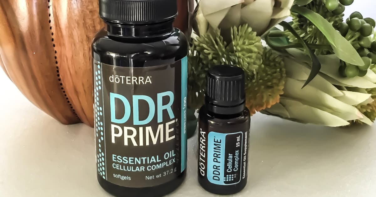 a bottle of doTERRA DDR Prime soft gels sitting next to a bottle of DDR Prime essential oil